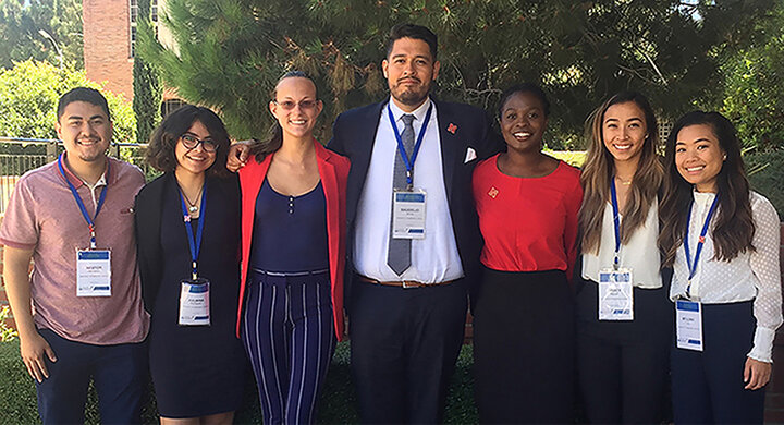 The photo portrays the community that McNair Scholars build within their cohorts. After spending the summer conducting research, they travel with their fellow scholars to present their research at a national McNair conference. This photo was taken at the University of California-Los Angeles National McNair Conference.